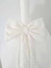Load image into Gallery viewer, The Mila Bow Orthodox Candle is made up or Pearl Lace and completed with a full Tulle Skirt.