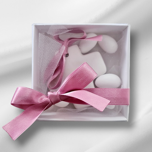 White ceramic cross bombonniere.