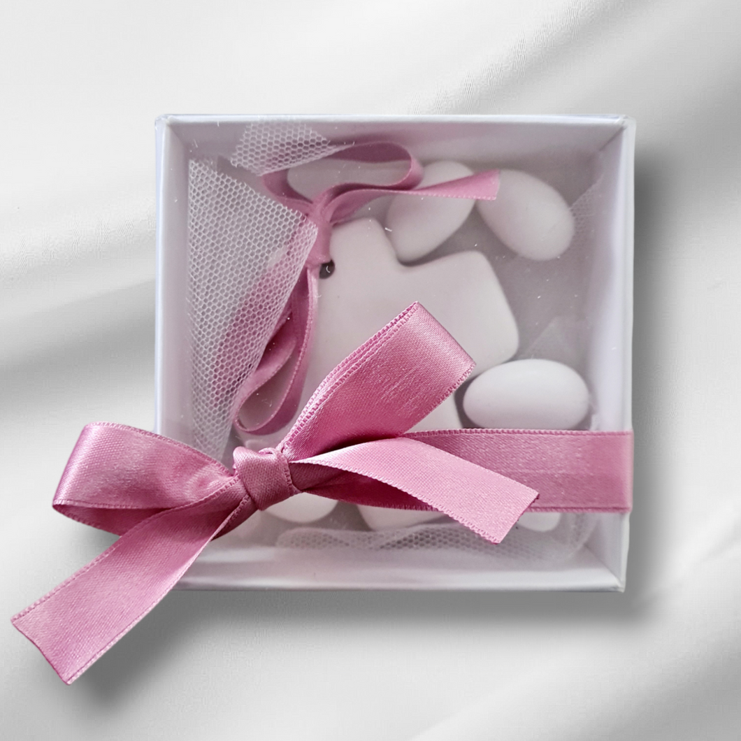 White ceramic cross bombonniere.